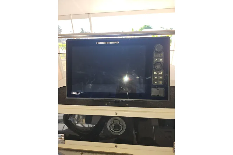 Slide: The Image of Humminbird Solix 10 fish finder on 2012 Sterling 220XS boat dashboard. - 12