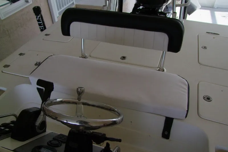 Slide: The Image of Sterling 220XS 2012 boat interior with steering wheel and seating area. - 18