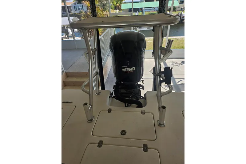 Slide: The Image of 2012 Sterling 220XS boat with Yamaha 250 outboard motor, docked near water. - 20