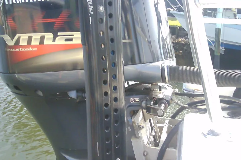 Slide: The Image of Sterling 220XS 2012 boat with Yamaha VMAX outboard motor, docked by the water. - 28