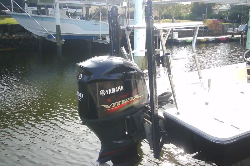 Slide: The Image of Sterling 220XS 2012 boat with Yamaha VMAX outboard motor on a calm waterway. - 43