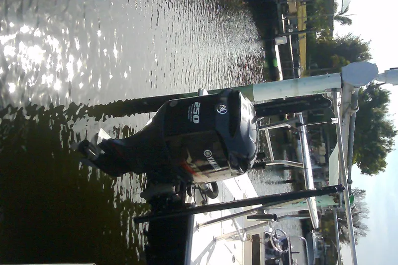 Slide: The Image of 2012 Sterling 220XS boat with Yamaha 250 outboard motor docked on a sunny day. - 45