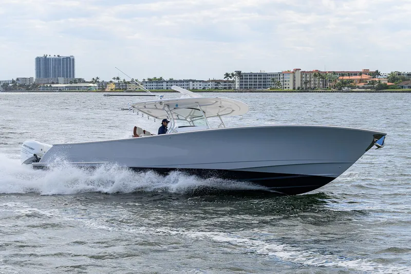 Slide: The Image of 2021 Valhalla Boatworks V-41 cruising on water near coastal buildings. - 12