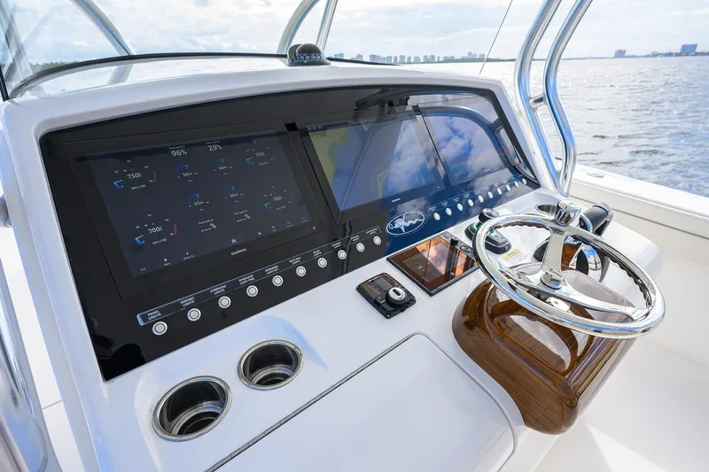 Slide: The Image of 2021 Valhalla Boatworks V-41 helm with advanced navigation displays and steering wheel. - 15