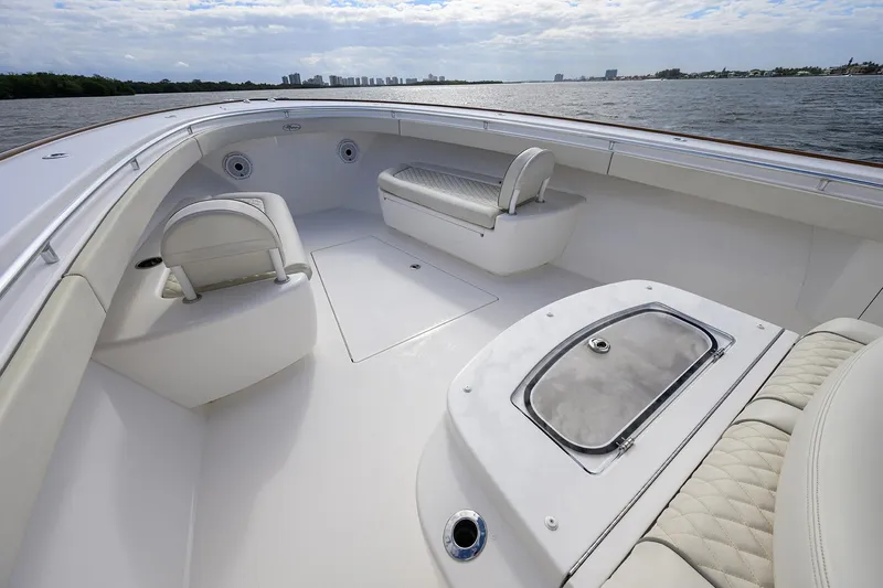 Slide: The Image of 2021 Valhalla Boatworks V-41 interior, featuring spacious seating and sleek design on open water. - 19