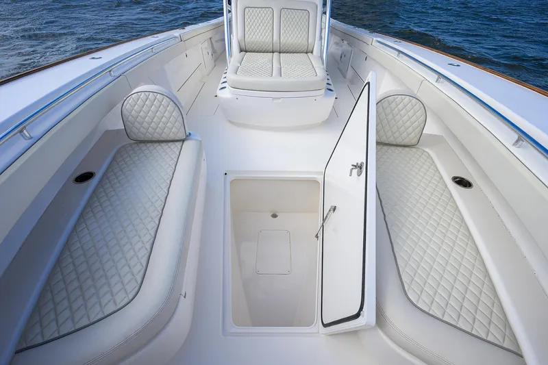 Slide: The Image of 2021 Valhalla Boatworks V-41 interior with luxurious seating and storage compartment. - 23