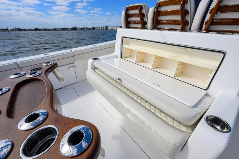 Slide: The Image of 2021 Valhalla Boatworks V-41 interior with seating and storage, featuring elegant wood accents. - 38