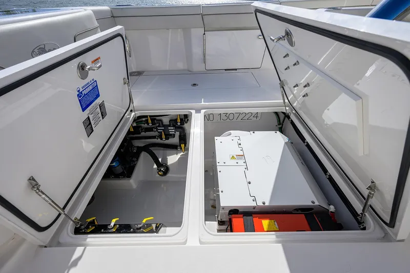Slide: The Image of 2021 Valhalla Boatworks V-41 storage compartments with equipment and wiring visible. - 49