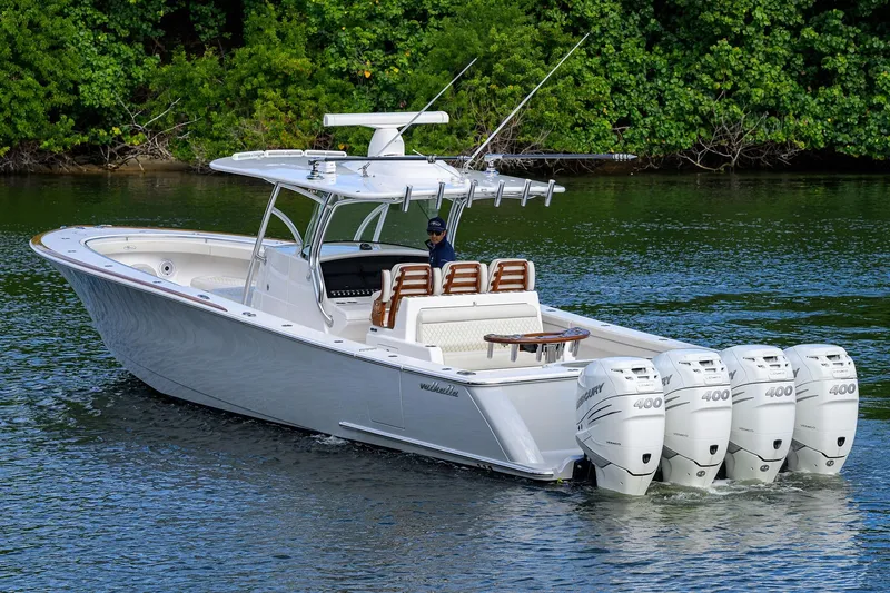Slide: The Image of 2021 Valhalla Boatworks V-41 with four Mercury 400 engines on a serene waterway. - 7