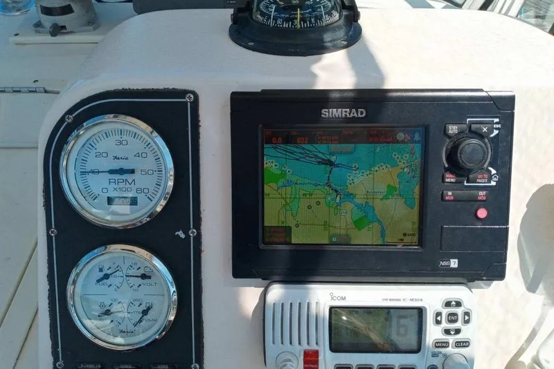 Slide: The Image of Dashboard of 2005 Shamrock 246 Adventurer with navigation and control instruments. - 4