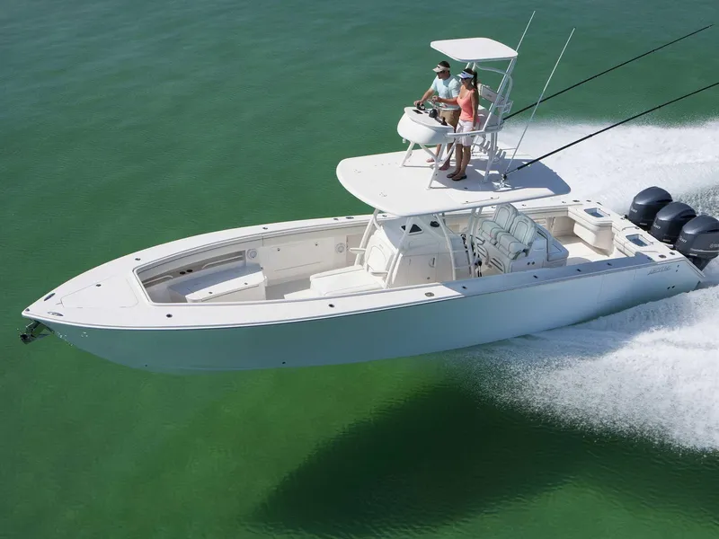 The Image of 2015 Jupiter 38 FS boat docked near waterfront buildings and palm trees. - 0