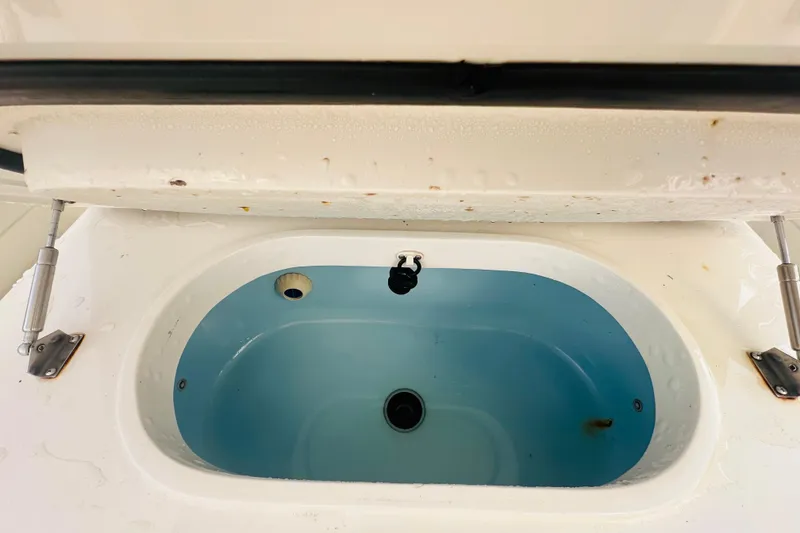 Slide: The Image of Livewell compartment on a 2015 Jupiter 38 FS boat, open and empty. - 13