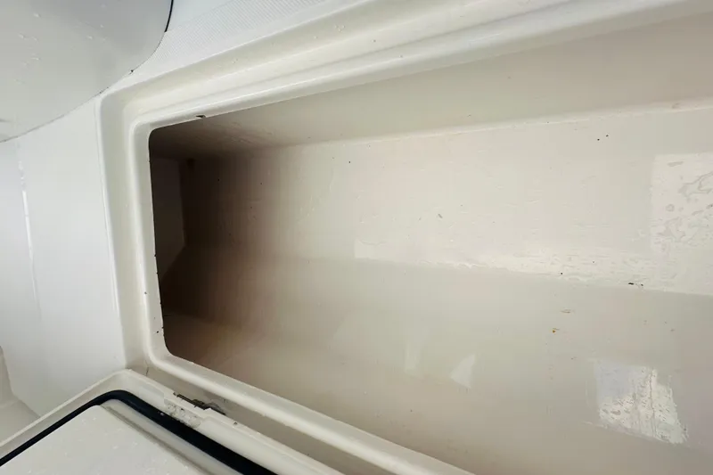 Slide: The Image of Empty storage compartment on a 2015 Jupiter 38 FS boat. - 16
