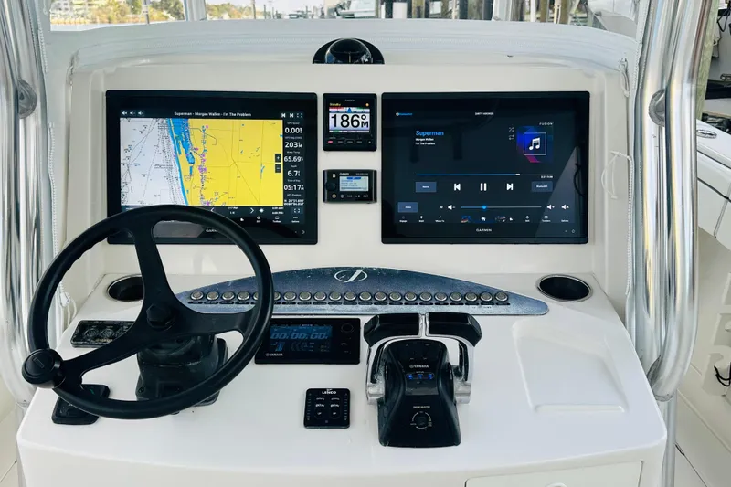 Slide: The Image of 2015 Jupiter 38 FS boat dashboard with navigation and control systems. - 20