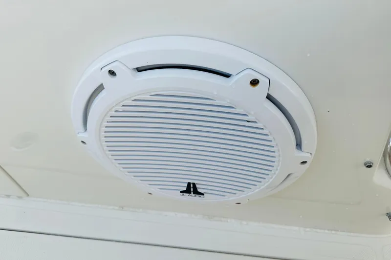 Slide: The Image of White speaker on 2015 Jupiter 38 FS boat ceiling, featuring JL Audio branding. - 27