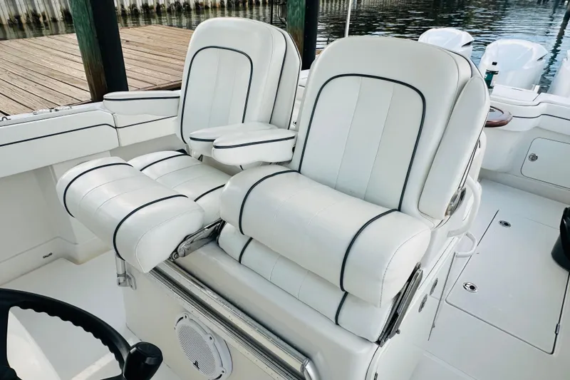 Slide: The Image of 2015 Jupiter 38 FS boat with luxurious white seating and sleek design. - 30