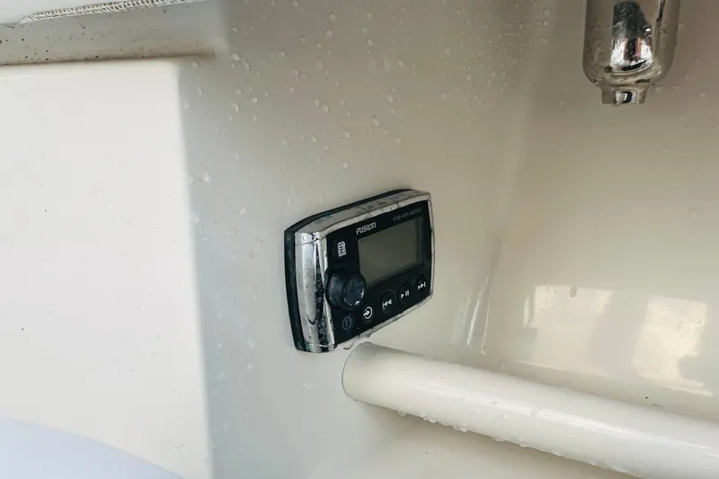 Slide: The Image of Fusion marine stereo on 2015 Jupiter 38 FS boat interior, with water droplets. - 32