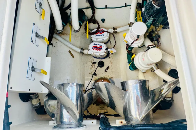 Slide: The Image of Engine compartment of 2015 Jupiter 38 FS boat with propellers and wiring. - 34