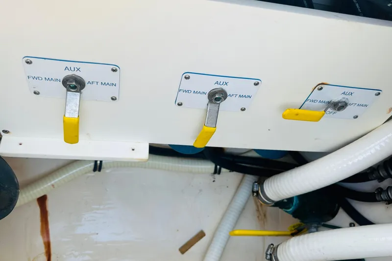 Slide: The Image of Control panel of a 2015 Jupiter 38 FS boat with auxiliary switches. - 36