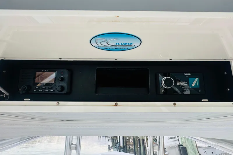 Slide: The Image of 2015 Jupiter 38 FS boat dashboard with Garmin and Fusion electronics. - 37