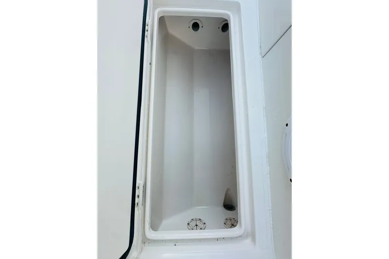 Slide: The Image of 2015 Jupiter 38 FS boat storage compartment, white interior, open lid. - 38