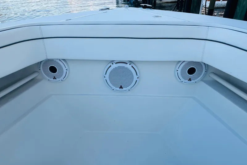 Slide: The Image of 2015 Jupiter 38 FS boat interior with speakers, docked by the water. - 39