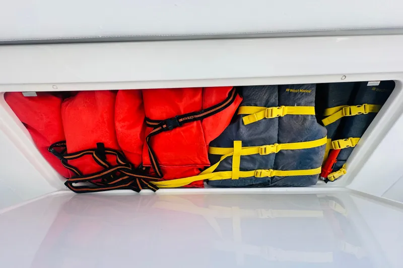 Slide: The Image of Life jackets stored in a 2015 Jupiter 38 FS boat compartment. - 40