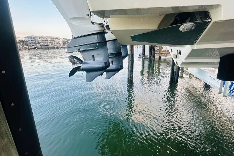 Slide: The Image of 2015 Jupiter 38 FS boat engine above water near dock. - 50