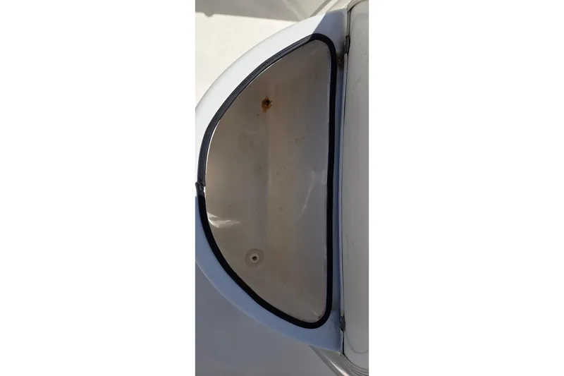 Slide: The Image of Storage compartment of a 2020 Cobia 237 Center Console boat, showing interior details. - 11