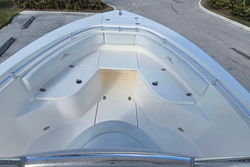 Slide: The Image of 2020 Cobia 237 Center Console boat interior with spacious seating and storage compartments. - 16