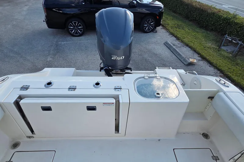 Slide: The Image of 2020 Cobia 237 Center Console boat with Yamaha 250 engine, featuring a clean deck layout. - 5