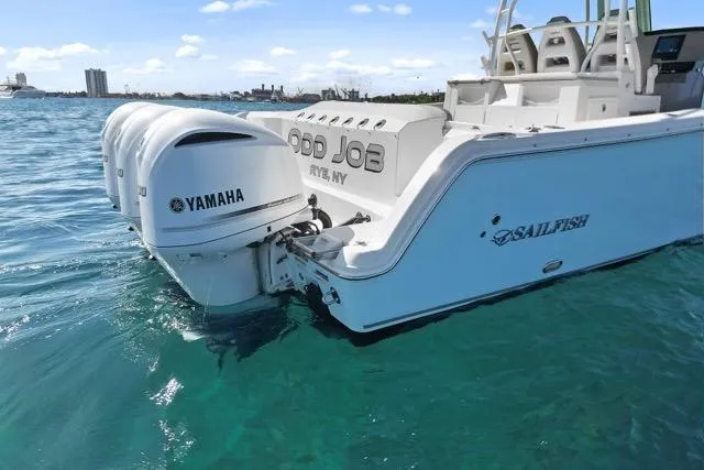Slide: The Image of 2019 Sailfish 360 CC boat with Yamaha engines on clear blue water. - 8