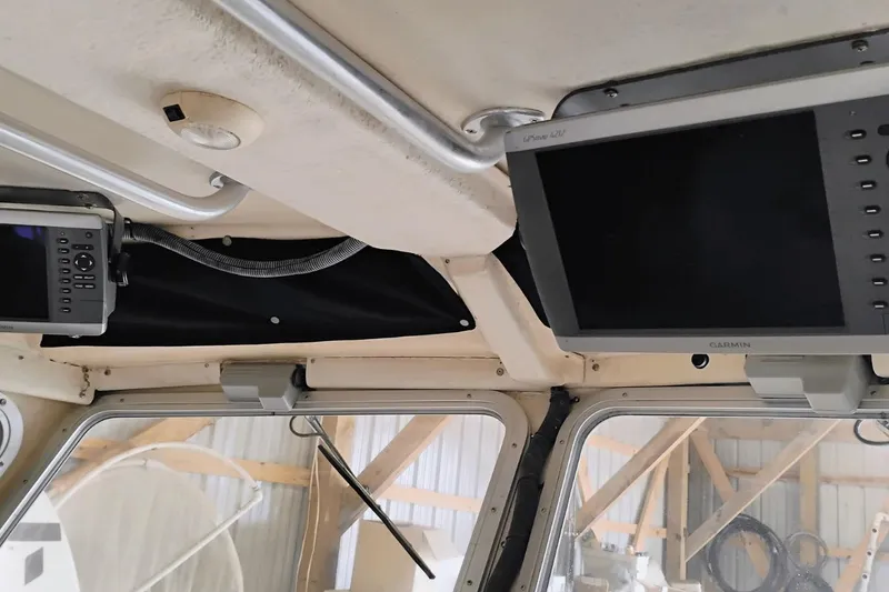 Slide: The Image of Interior of a 2009 McKee Craft 28 boat with Garmin navigation equipment. - 7