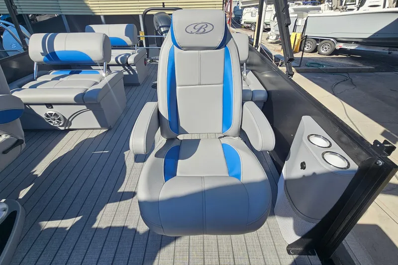 Slide: The Image of 2026 Bentley Pontoons LEGACY 243 QUAD SWINGBACK interior with blue and gray seating. - 14