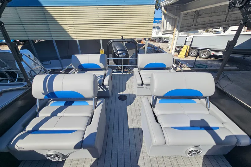 Slide: The Image of 2026 Bentley Pontoons LEGACY 243 QUAD SWINGBACK interior with stylish seating arrangement. - 15