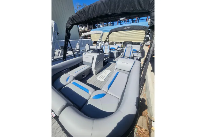 Slide: The Image of 2026 Bentley Pontoons LEGACY 243 QUAD SWINGBACK with luxurious seating and sleek design. - 7