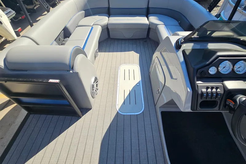 Slide: The Image of 2026 Bentley Pontoons LEGACY 243 QUAD SWINGBACK interior with luxurious seating and modern dashboard. - 8