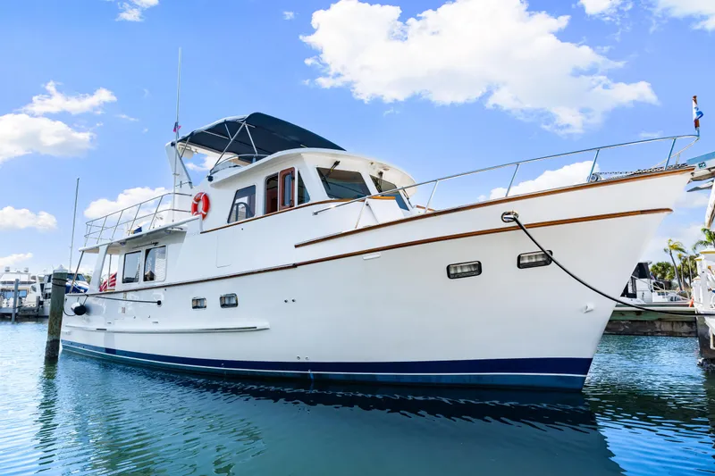 Slide: The Image of 2008 DeFever 52 Euro yacht docked under a clear blue sky. - 24