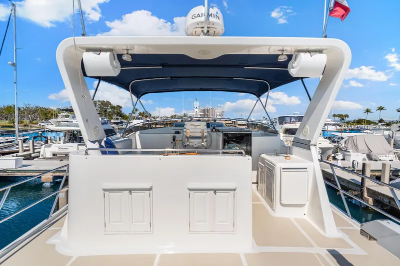 Slide: The Image of 2008 DeFever 52 Euro yacht docked at marina under clear blue sky. - 38