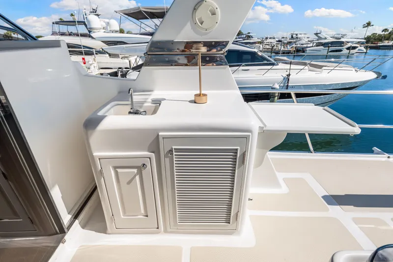 Slide: The Image of Outdoor sink and storage on 2008 DeFever 52 Euro yacht, docked at marina. - 41