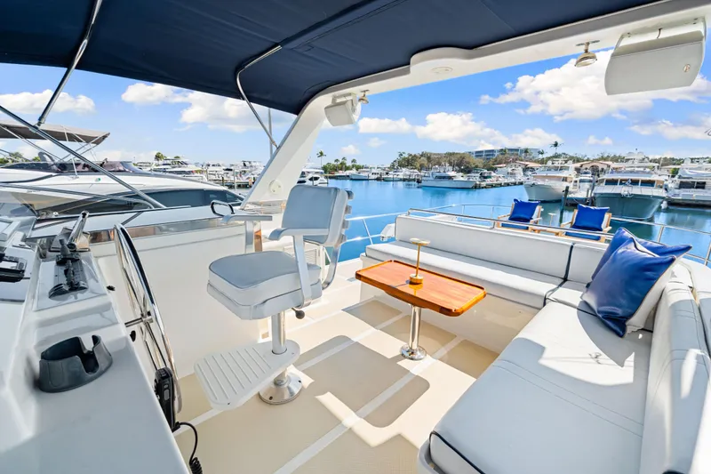 Slide: The Image of Luxurious 2008 DeFever 52 Euro yacht interior with seating and helm, docked at marina. - 43