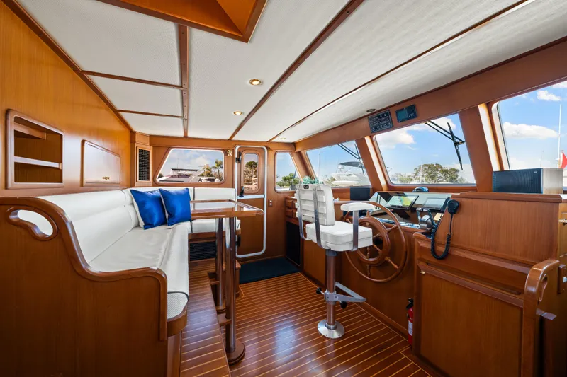 Slide: The Image of Luxurious interior of 2008 DeFever 52 Euro yacht with wooden finishes and modern helm. - 52