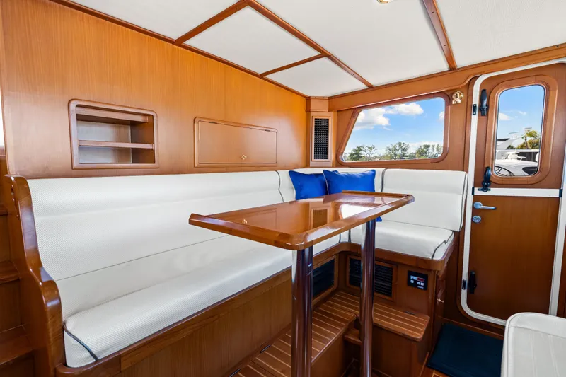 Slide: The Image of Luxurious interior of 2008 DeFever 52 Euro yacht with wood finish and white seating. - 53