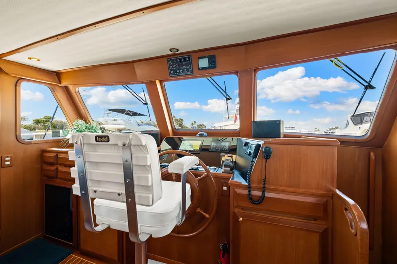 Slide: The Image of 2008 DeFever 52 Euro yacht helm with wooden interior and navigation equipment. - 54