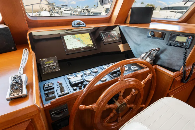 Slide: The Image of Pilothouse of 2008 DeFever 52 Euro yacht with navigation equipment and wooden steering wheel. - 55