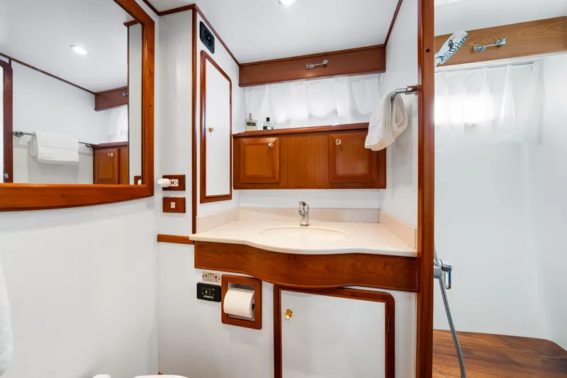 Slide: The Image of Luxurious 2008 DeFever 52 Euro yacht bathroom with wood accents and modern fixtures. - 73