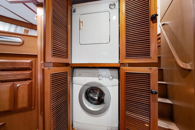 Slide: The Image of Laundry area with stacked washer and dryer in 2008 DeFever 52 Euro yacht. - 76