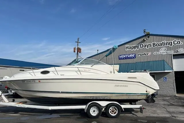 The Image of 1996 Rinker Fiesta Vee 265 boat on trailer at Happy Days Boating Co. dealership. - 0