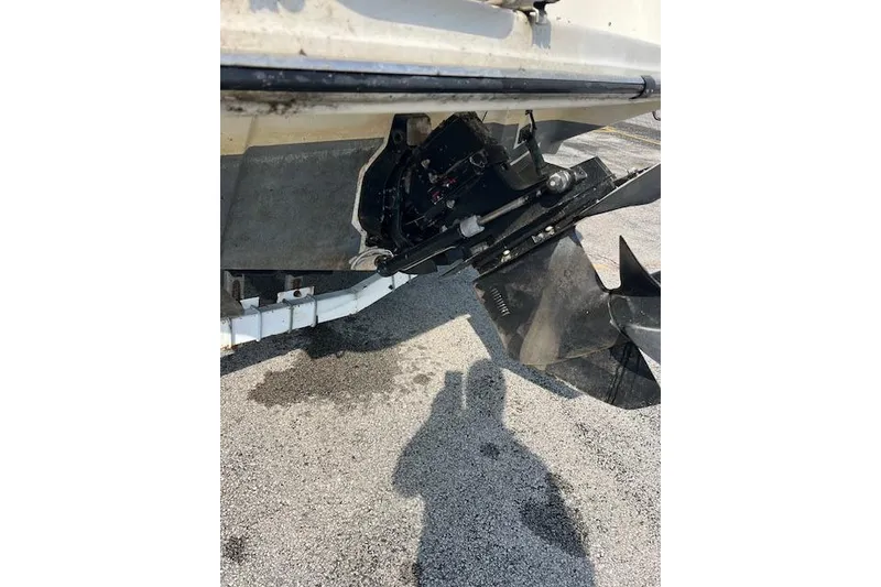 Slide: The Image of 1996 Rinker Fiesta Vee 265 boat stern drive and propeller detail. - 13