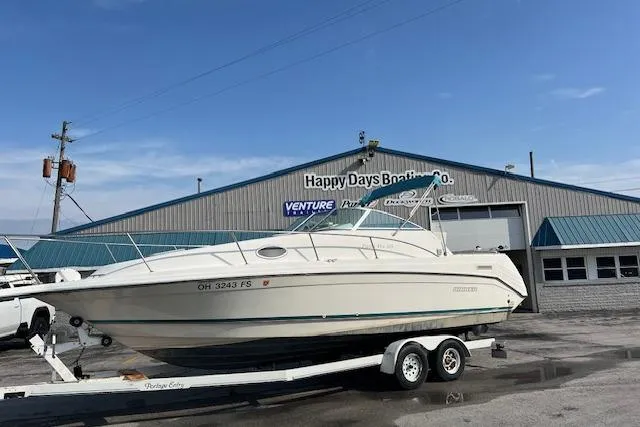 Slide: The Image of 1996 Rinker Fiesta Vee 265 boat on trailer at Happy Days Boating Co. - 2